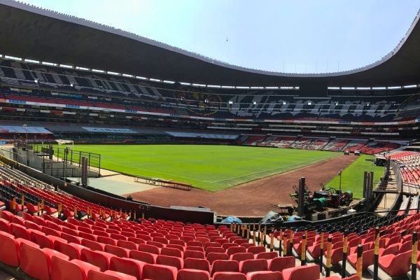 View of the Estadio Azteca pitch near Nachito’s statue, highlighting the iconic football field.