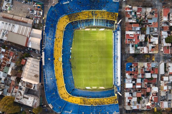 Aerial view of La Bombonera stadium in Buenos Aires, showcasing the iconic blue and yellow stands of Boca Juniors.