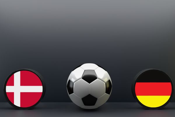 Danish and German flags positioned on either side of a football.