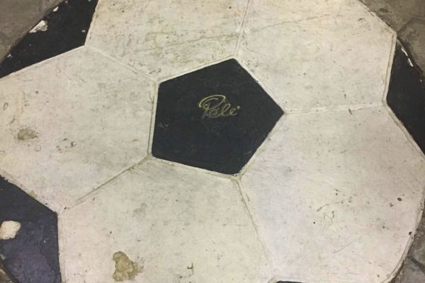 Pelé's signature on the football design flooring at Estadio Azteca.