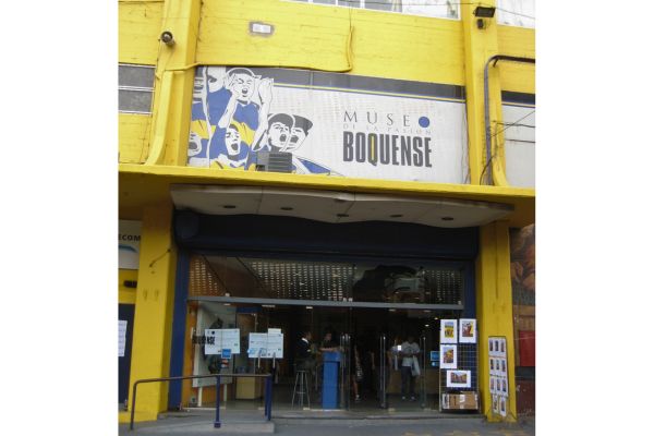 The outside entrance to the Museo de la Pasión Boquense, Boca Juniors Museum, featuring large blue and yellow signage