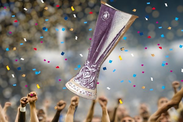 AI-generated image of the European Cup being thrown into the air with celebrating hands and confetti.