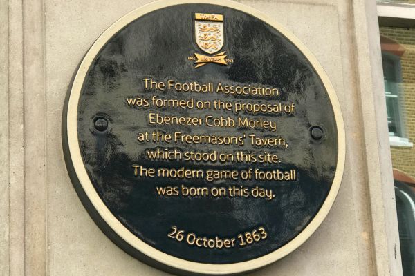 Commemorative plaque on the wall of the building at the original site of Freemasons Tavern, marking the birth of modern football.