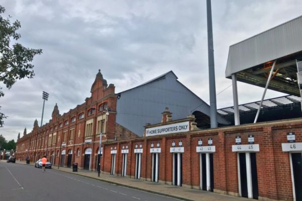 Exterior view of Craven Cottage stadium in Fulham, with its distinctive brick façade.