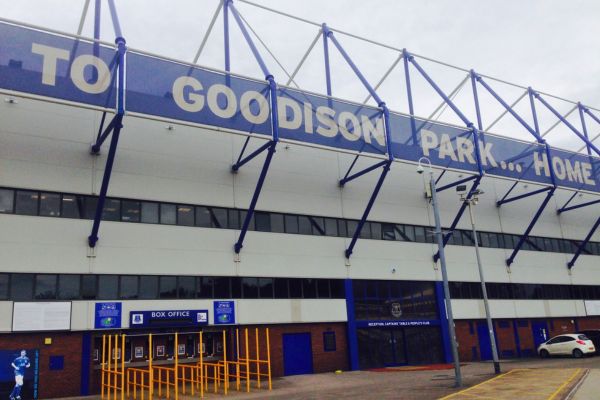 Back view of a stand at Goodison Park with 'Goodison Park' sign across the top