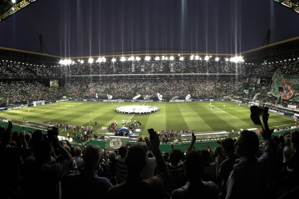 Matchday atmosphere inside Sporting Lisbon’s stadium with fans cheering.