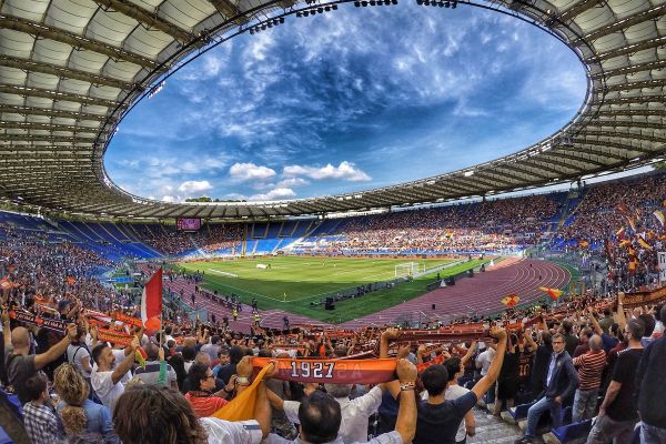 Fans inside Stadio Olimpico during a football match.