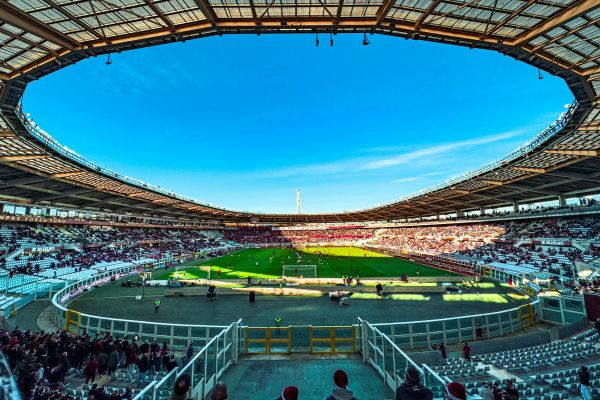 Interior view of Stadio Olimpico Grande Torino, showcasing the vibrant atmosphere during a football match.