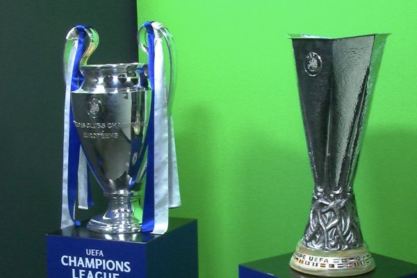 Champions League and Europa League replica trophies on display at Chelsea museum and stadium tour.