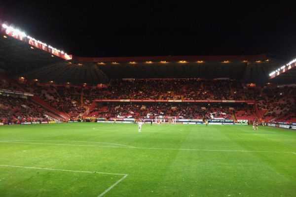 Match under floodlights at The Valley Stadium