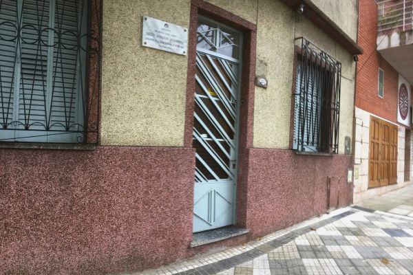 Mural outside Casa de D10S, the childhood home where Diego Maradona lived during his time at Argentinos Juniors, depicting his early footballing journey.