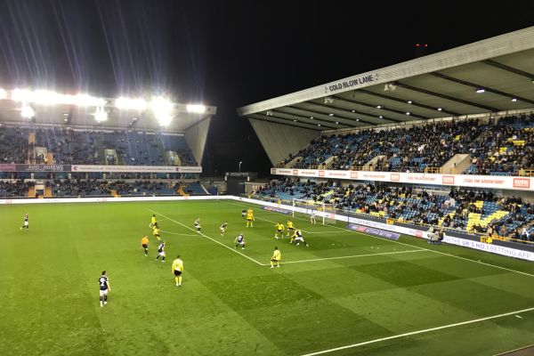 Genuine goalmouth action during a match at The Den, showcasing the excitement of Millwall FC games.