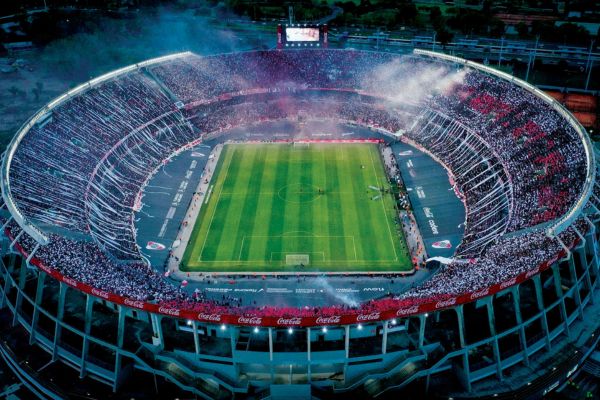 Aerial view of River Plate's Monumental Stadium packed with fans during a football match.