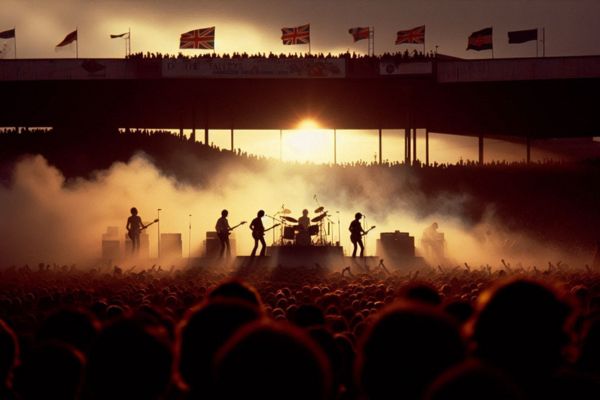 Illustrated silouette image of the band The Who playing a concert at the Valley, Charlton Atheltic in 1976.