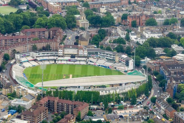 Aerial view of The Oval cricket ground, showcasing its distinctive layout, lush green pitch, and surrounding modern facilities.