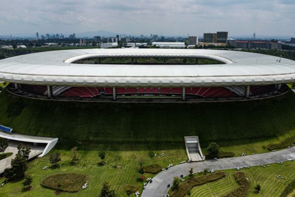 Exterior view of Akron Stadium surrounded by lush green grass banks.