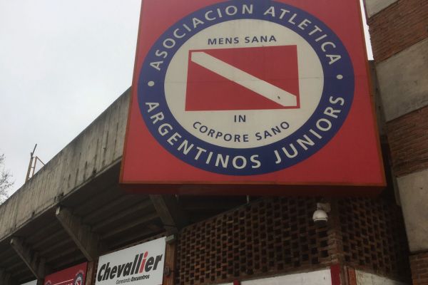 Argentinos Juniors badge displayed over the entrance of Estadio Diego Armando Maradona.