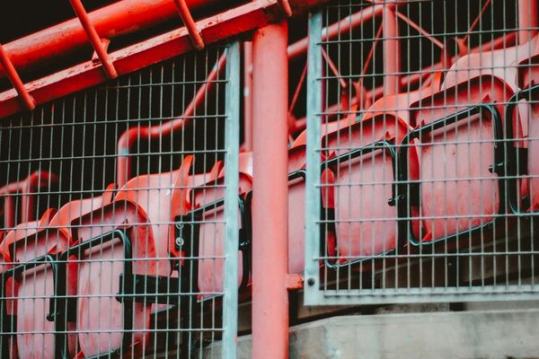 View of the vibrant red seats inside Ashton Gate Stadium, home of Bristol City FC.