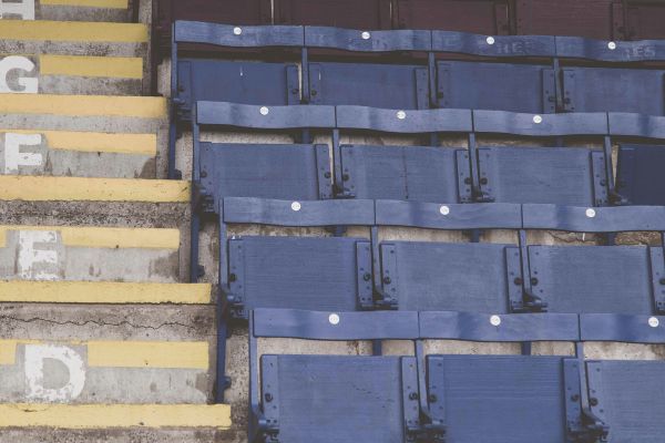 Vintage wooden seats at Turf Moor Stadium, reflecting Burnley FC's historic charm.