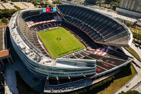 Aerial view of an empty Soldier Field stadium in Chicago, showcasing its iconic colonnades and field.