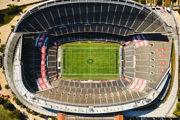 Aerial view of an empty Soldier Field stadium in Chicago, showcasing its iconic colonnades and field.