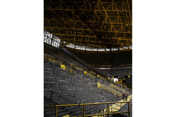 Empty Yellow Wall terrace at Signal Iduna Park in Dortmund, Germany, showing the largest standing section in European football.