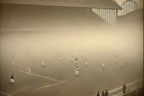 In the midst of heavy fog, football players battle on the pitch, their figures faintly visible through the mist. (Ai generated)