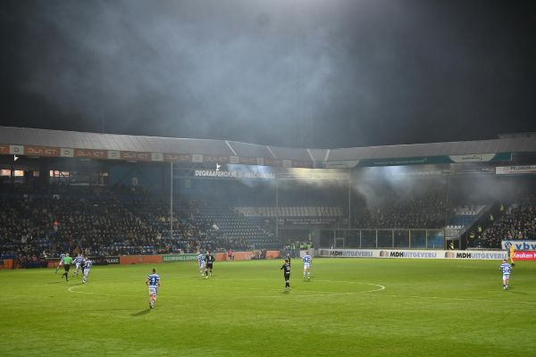 De Graafschap match under floodlights at De Vijverberg stadium.