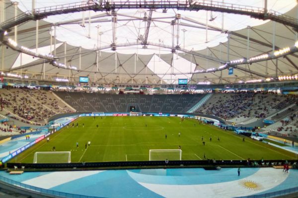 Interior view of Estadio Ciudad de La Plata during a football match.