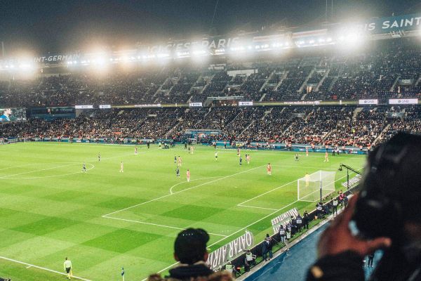 View from the stands during a night game at PSG’s Parc des Princes stadium.