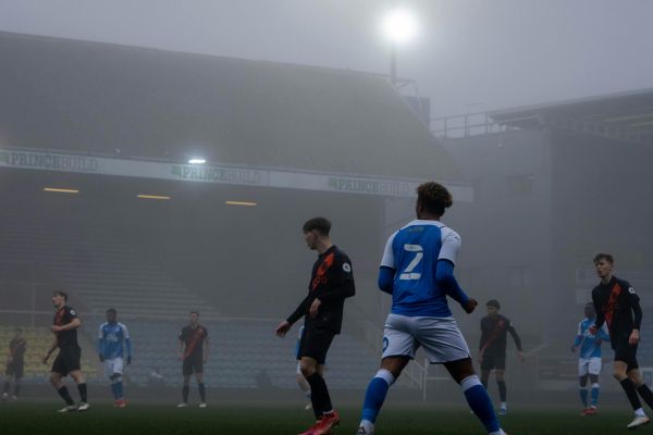 Football match in foggy conditions at Peterborough United’s stadium.