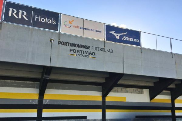 Back of the stand at Portimonense Stadium, with Portimonense S.C. written prominently on it.