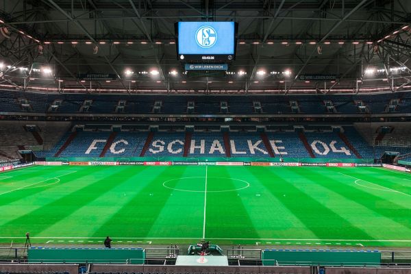 Interior view of an empty Veltins-Arena, home of Schalke 04 in Gelsenkirchen, Germany, showcasing its modern design.