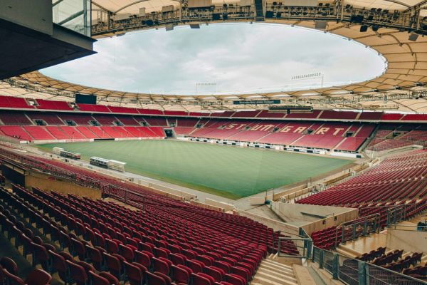 Inside view of the empty MHP Arena, showcasing the stands and pitch.