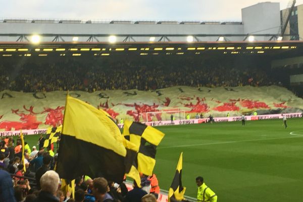 Watford tifo being raised at the Rookery End before kickoff against Arsenal