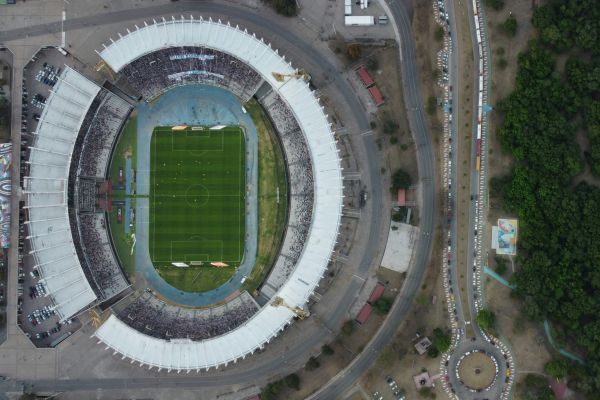 Aerial view of Estadio Mario Alberto Kempes in Córdoba, Argentina, showcasing its oval structure and surrounding landscape.