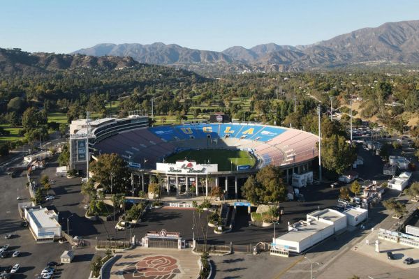 A breathtaking aerial view of the Rose Bowl Stadium in Pasadena, California, showcasing its iconic oval design and scenic surroundings.