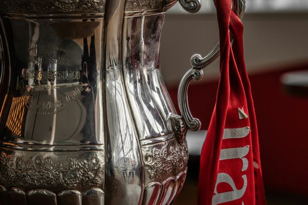 Image of the FA Cup with red ribbon