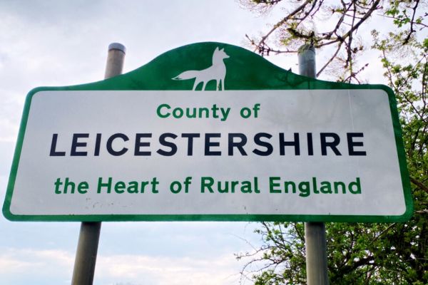 Leicestershire county sign with a fox silhouette, symbolizing the region’s historic connection to foxes.