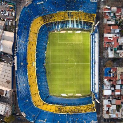 Aerial view of La Bombonera stadium in Buenos Aires, showcasing the iconic blue and yellow stands of Boca Juniors.