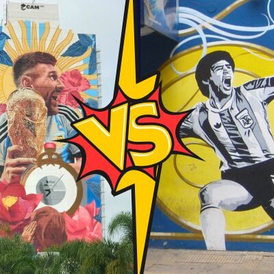 Murals of Lionel Messi and Diego Maradona side by side with 'vs' written in between, representing the rivalry over who is football's greatest.