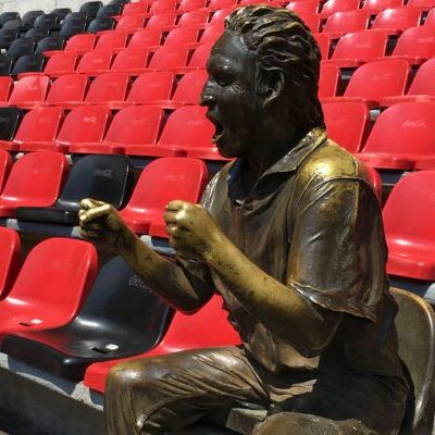 Angle view of Nachito’s statue at Estadio Azteca, honoring football fan Ignacio Villanueva.