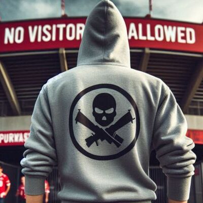 A single football fan in a hoodie with a unique design on the back stands in front of a 'No Visitors Allowed' sign outside a generic stadium.